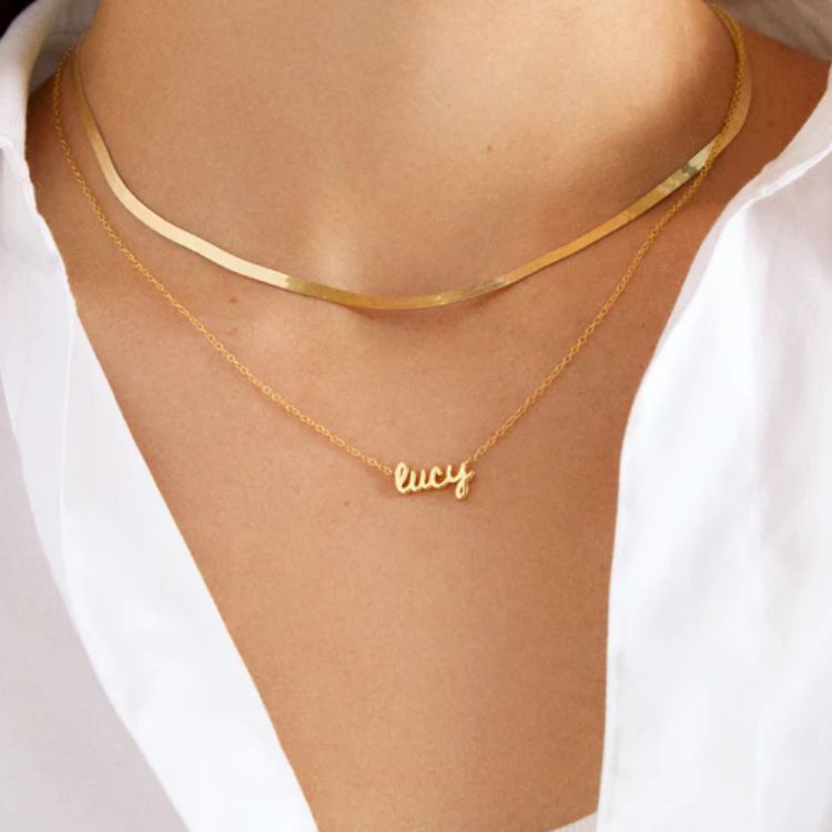 Gold custom nameplate necklace with personalized script text.