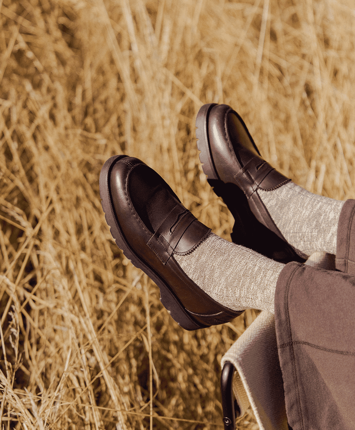Detail shot of sleek black leather loafers featuring a slim silhouette and modern design.