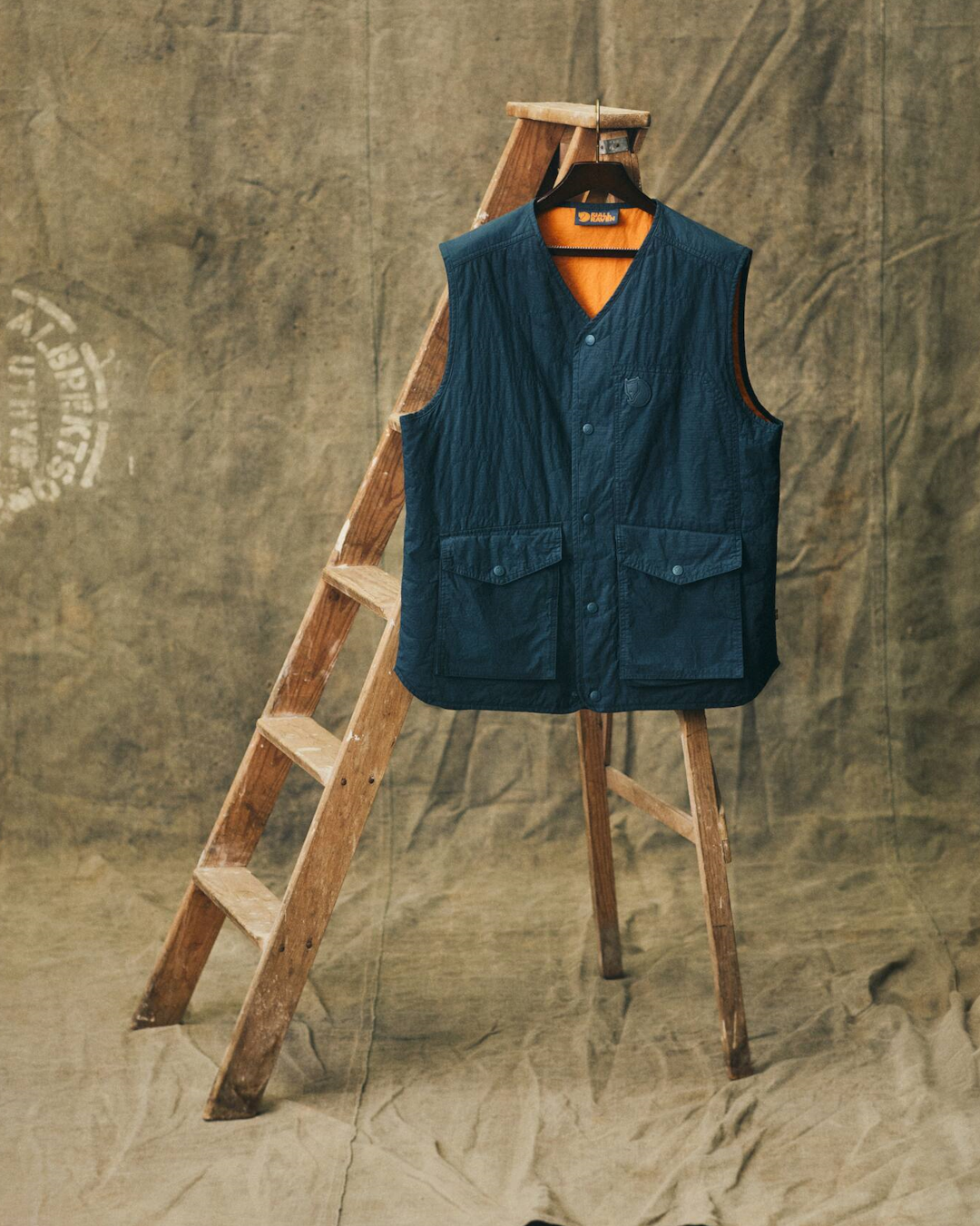 A detail shot of the Samlaren Gilet showing its utility-focused design and color-blocked pockets.
