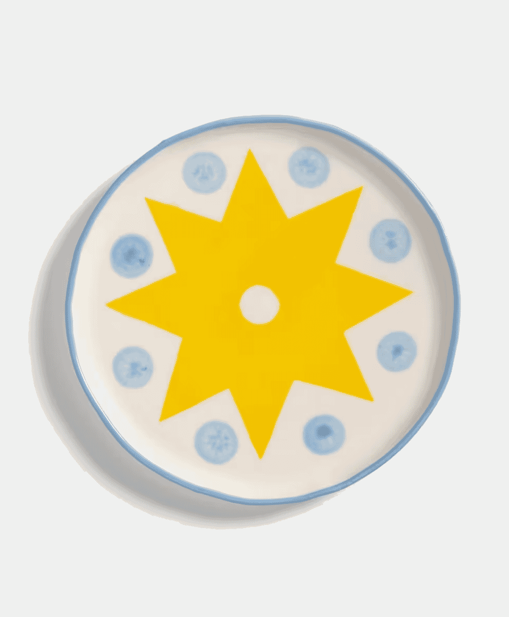 Multiple &Klevering plates arranged for a buffet-style setting.