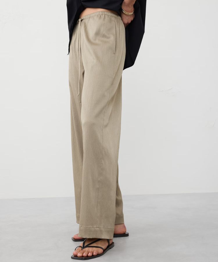 Wide-leg satin pull-on pants in a soft hue.