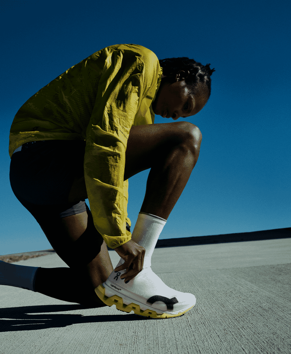 Side profile of the On Cloudmonster 3 Hyper highlighting the high-stack cushioning and thin upper.