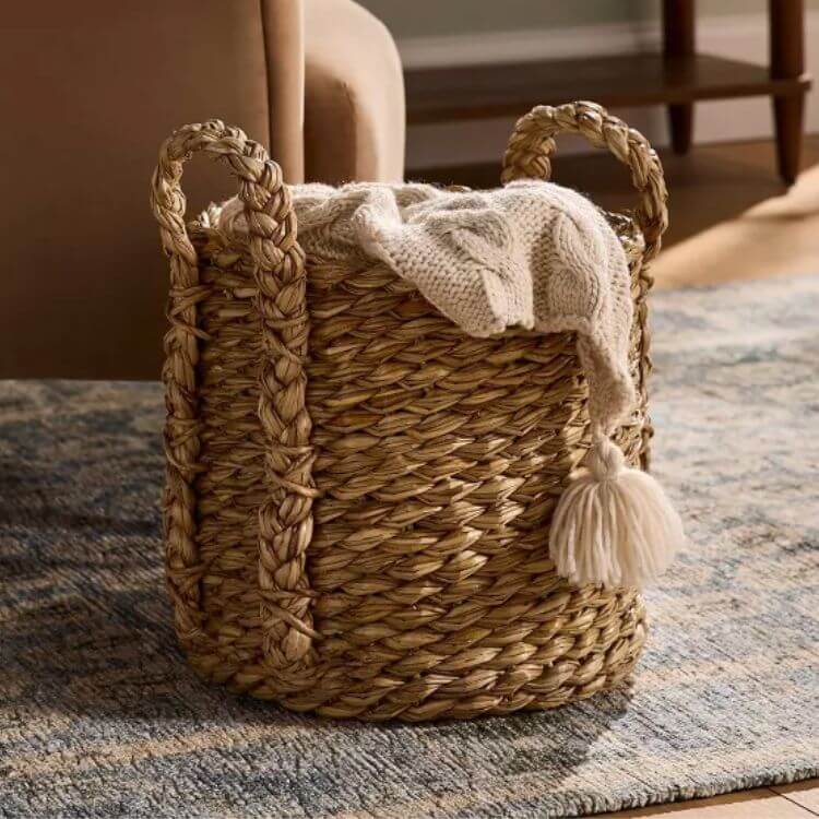 Large chunky weave storage basket with handles.