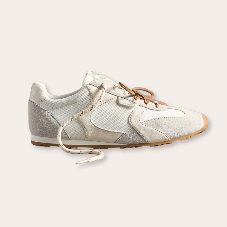 White sneakers with suede textural accents.