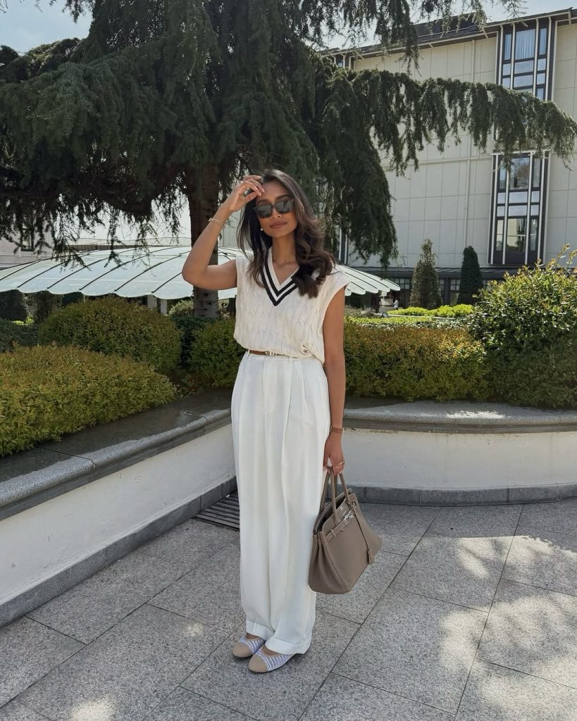 A minimalist office look featuring a blazer and wide leg trousers.