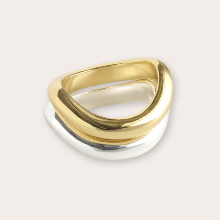 A chunky, wavy-textured silver ring.