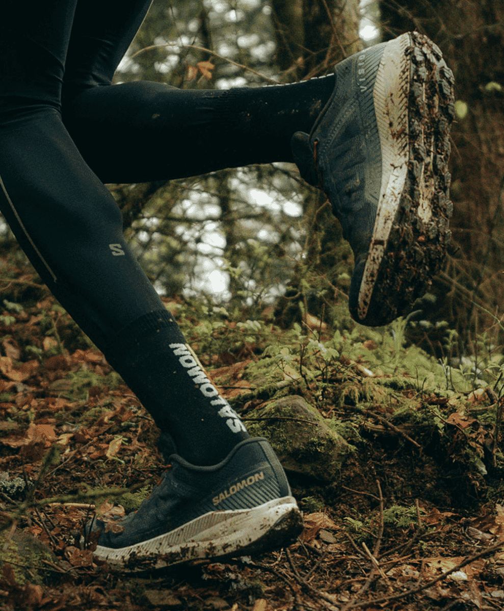 Lifestyle shot of technical shoes worn with casual urban clothing.
