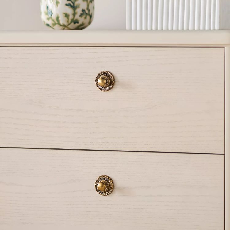 Set of two heritage-style decorative cabinet knobs.