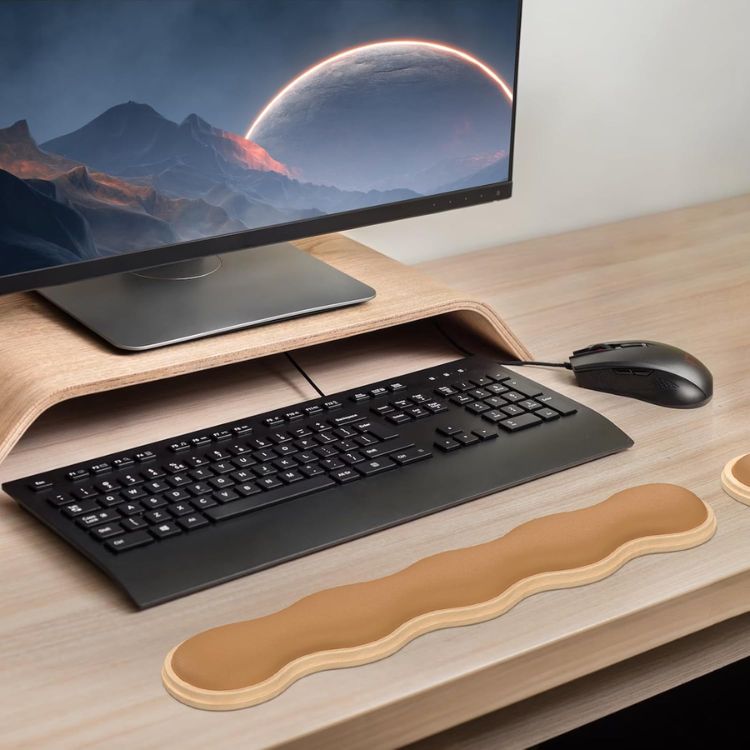 White wavy-shaped ergonomic wrist rest for a computer keyboard