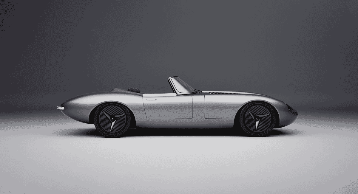 Silver Jaguar E-type Concept with dramatic lighting highlighting its 19-inch aero-disc wheels.
