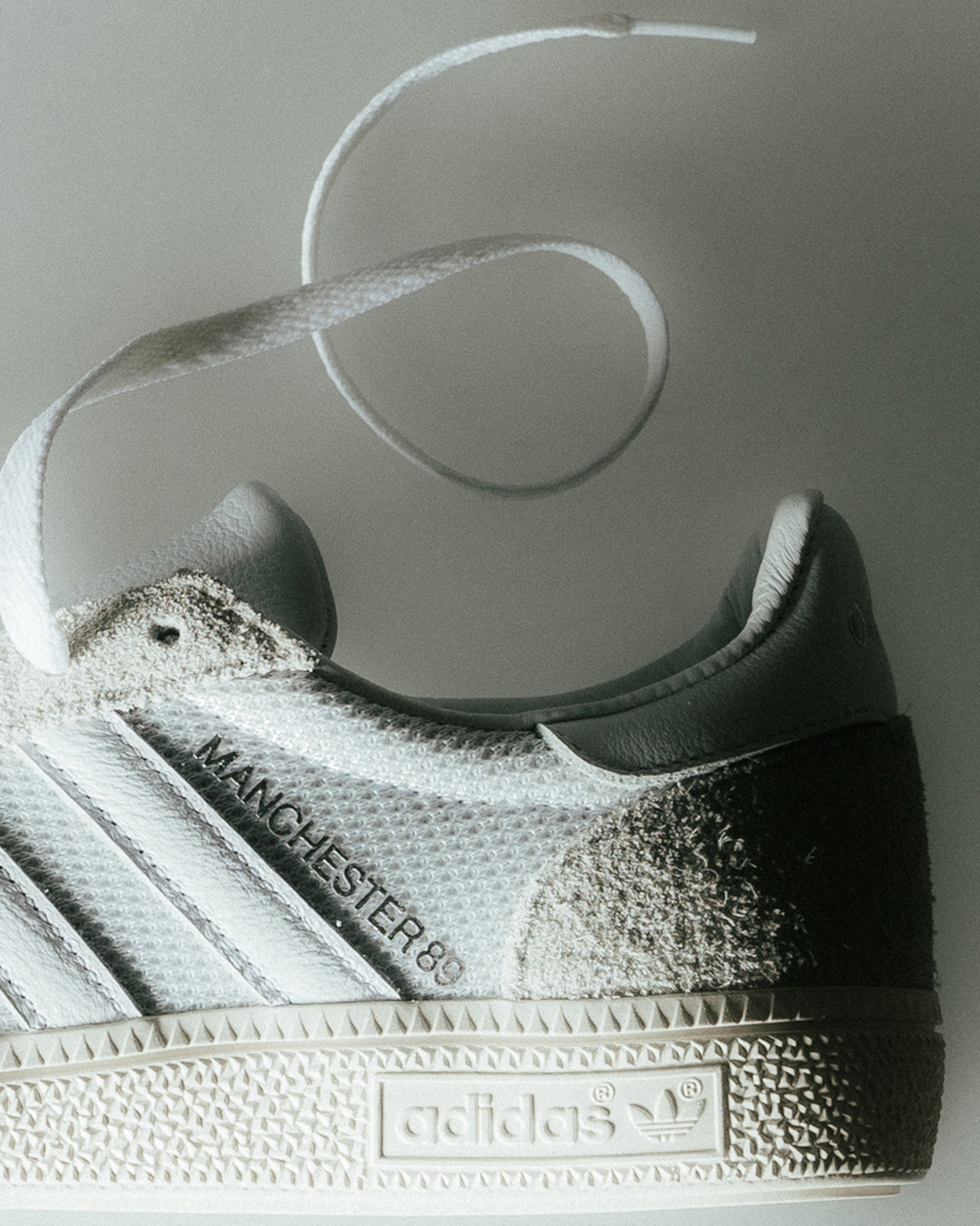Close-up detail of the 'Made in Germany' tag on the interior tongue of the sneaker.