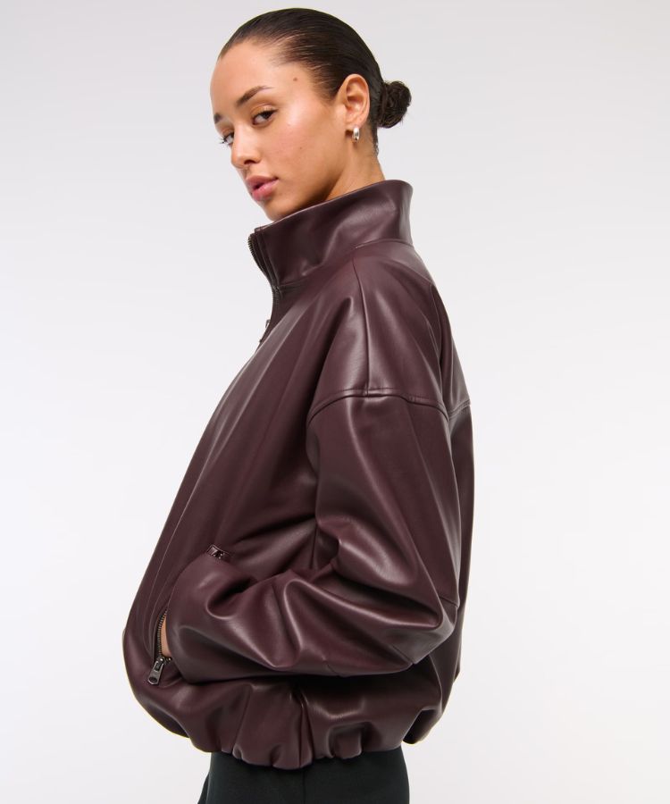 Cropped bubble hem jacket made from black vegan leather.