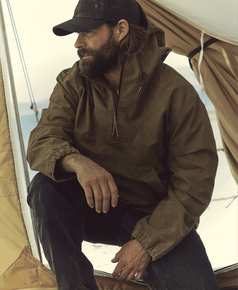 Close-up of a Filson tin cloth jacket highlighting the waxed texture.