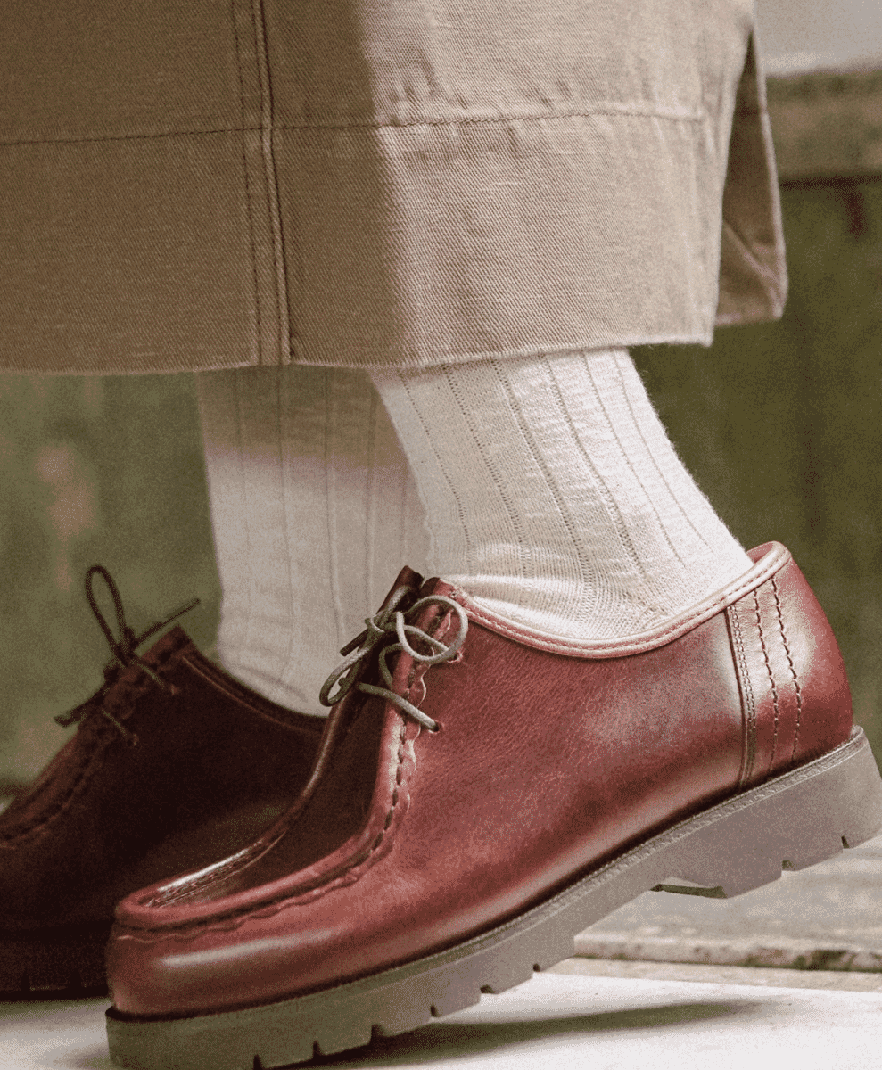 Polished burgundy leather derby shoes paired with white ribbed socks.