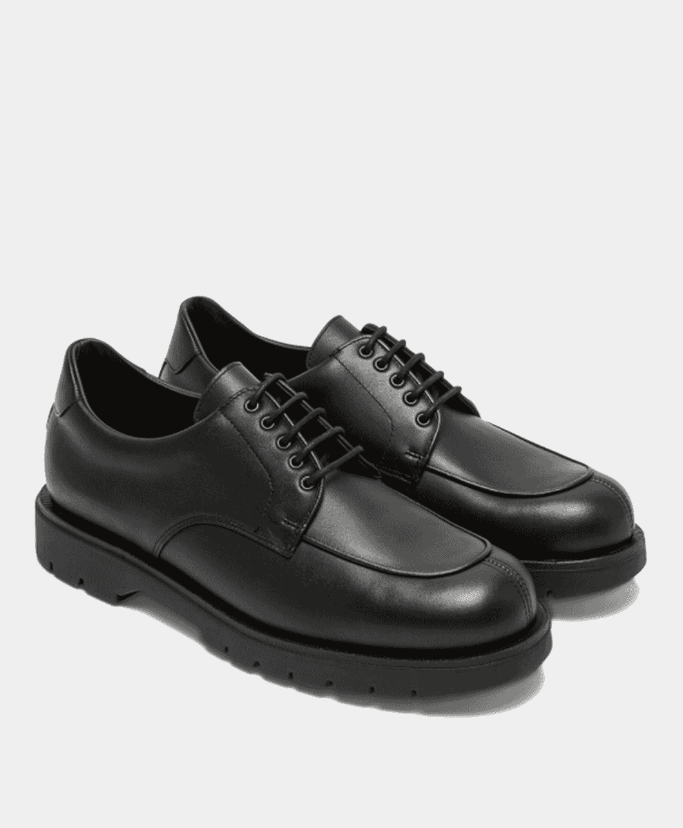 Black leather dress shoes with thick rubber soles.