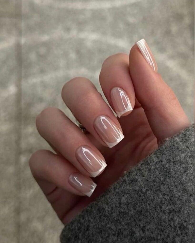 Earthy-toned neutral manicure with a muted, professional palette.