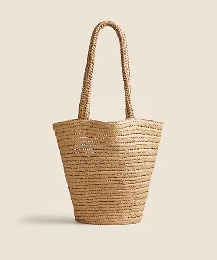 A handwoven straw tote bag.