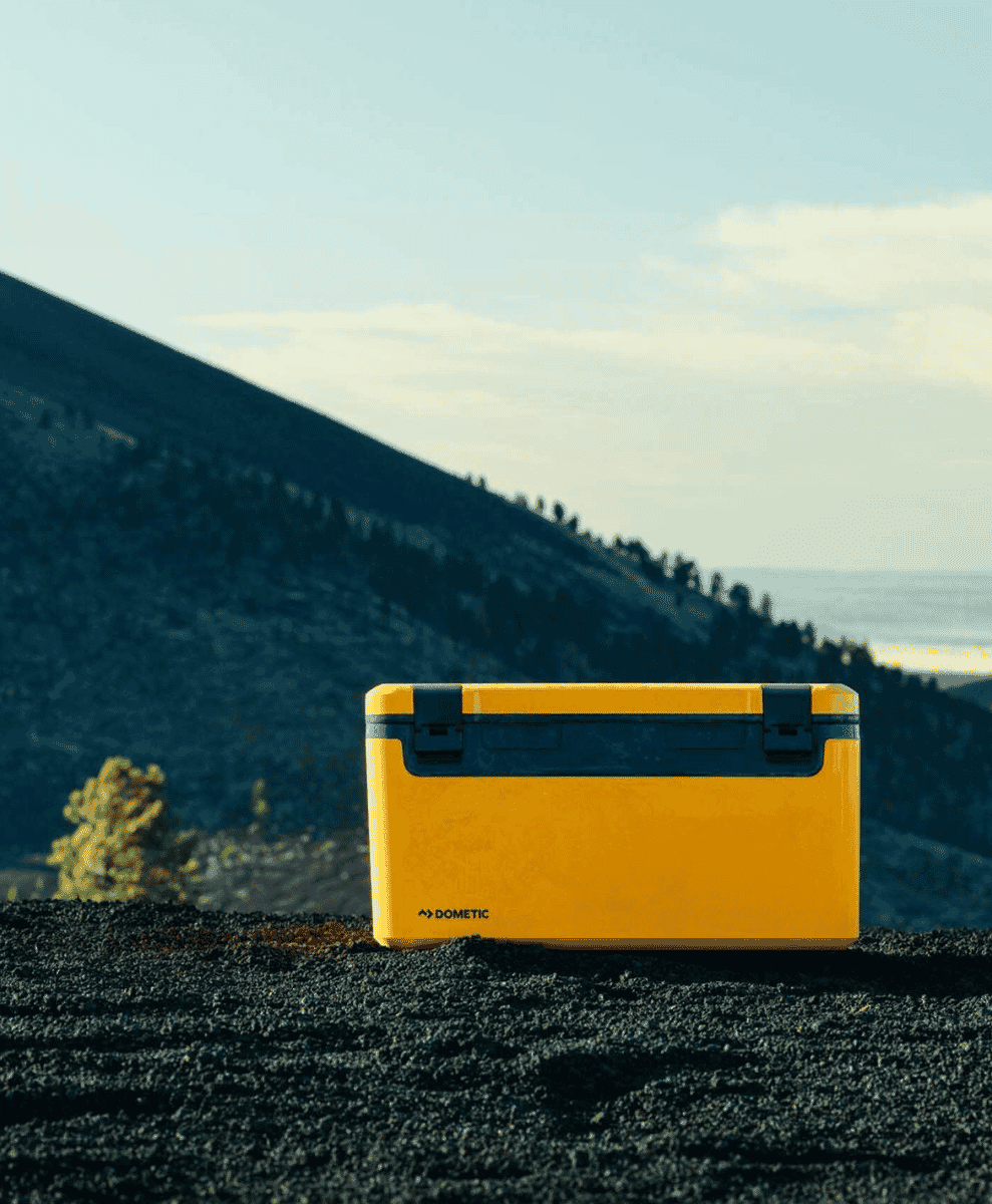 The Dometic Recon Cooler placed alongside outdoor seating.