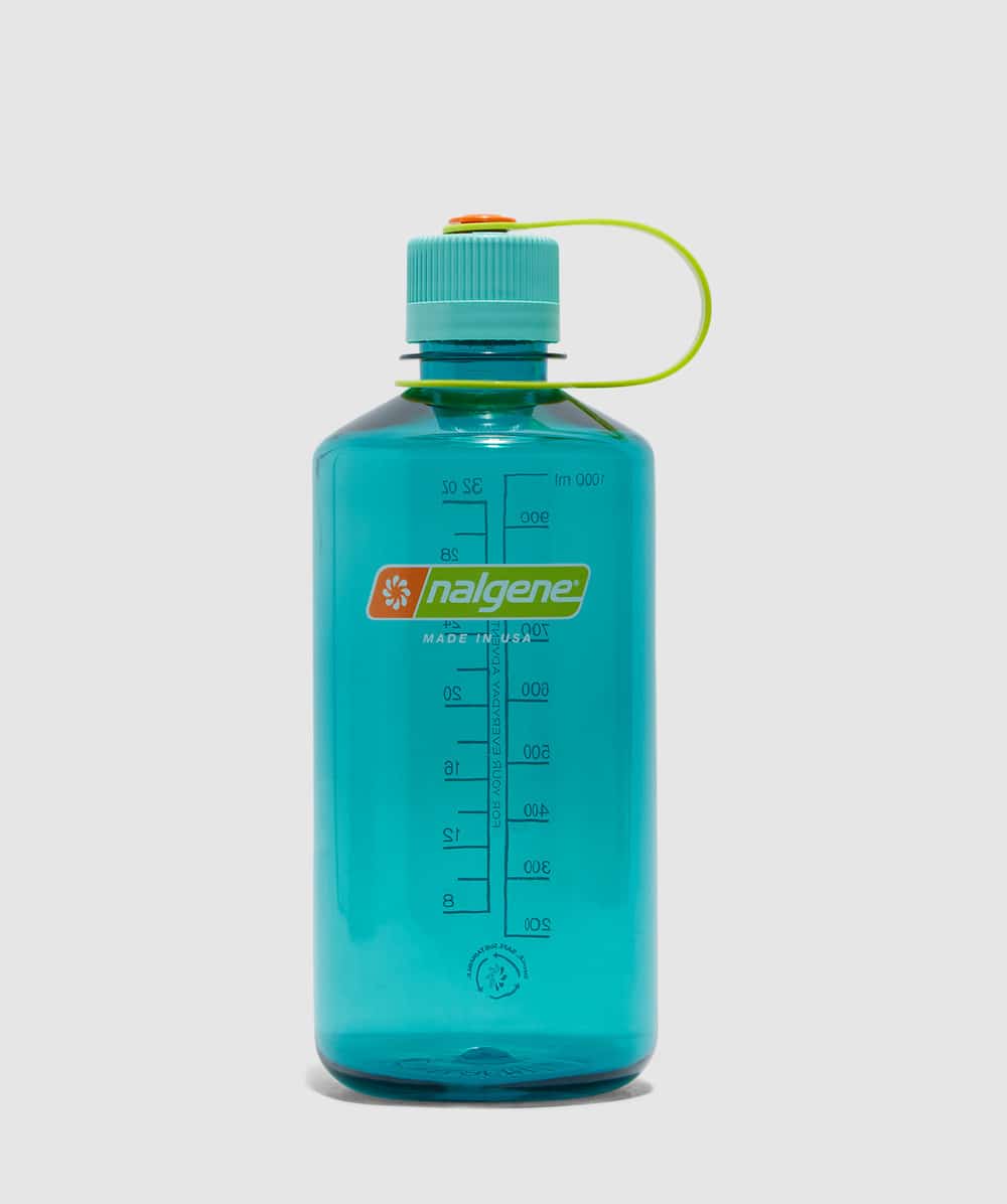 A translucent teal Nalgene water bottle with a turquoise cap and measurement markings.
