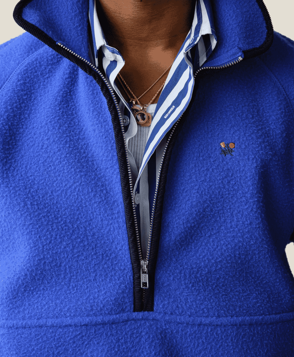 A combination of earthy outerwear and vibrant primary-colored accessories.