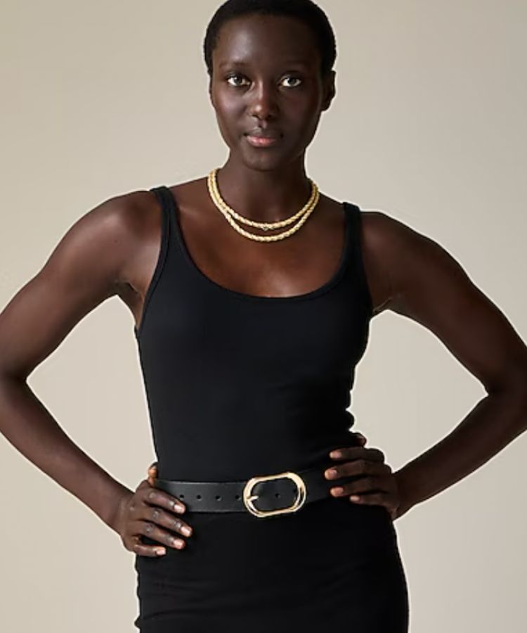 A white scoop-neck tank top.
