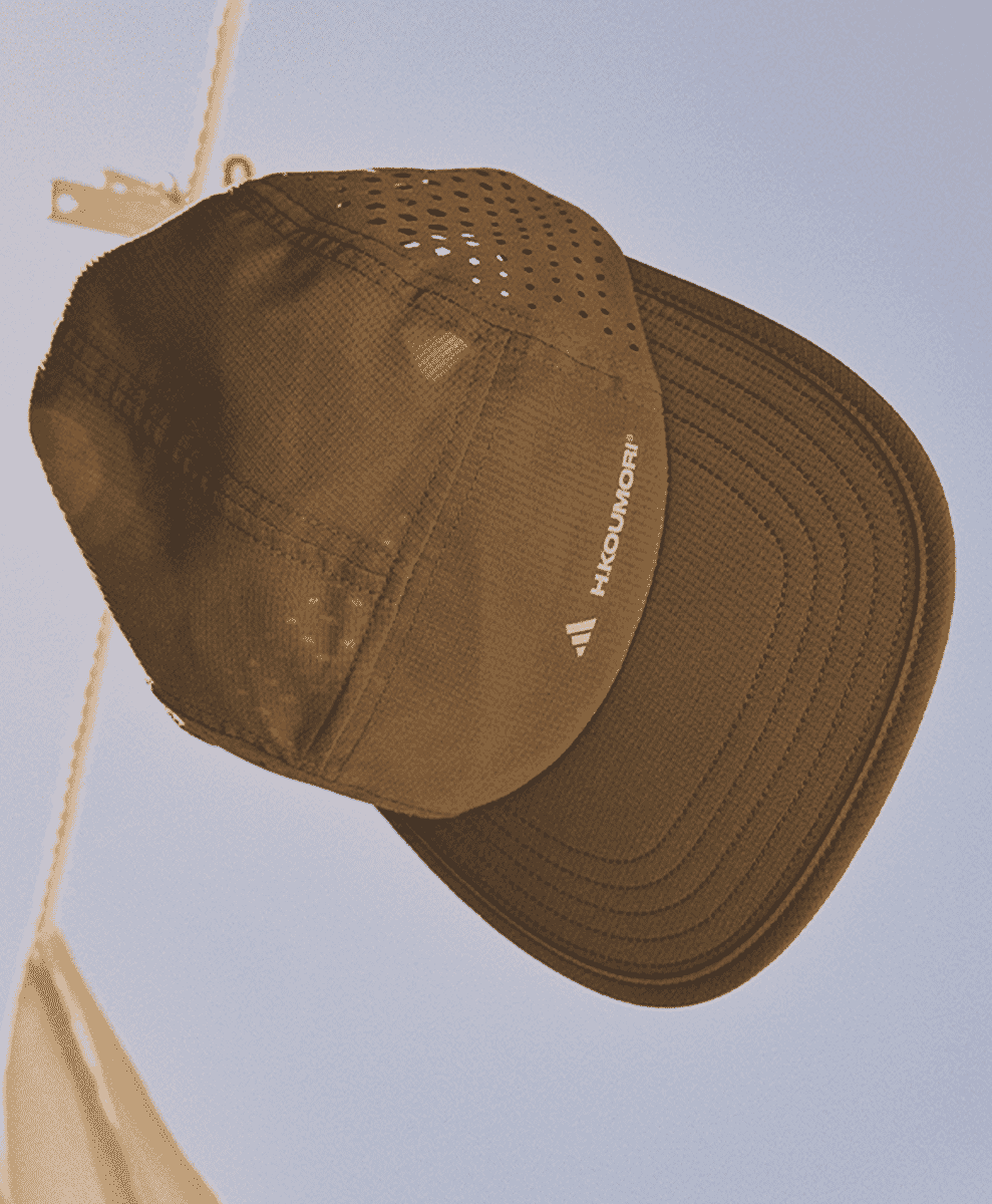 A brown breathable running cap with H.KOUMORI branding.