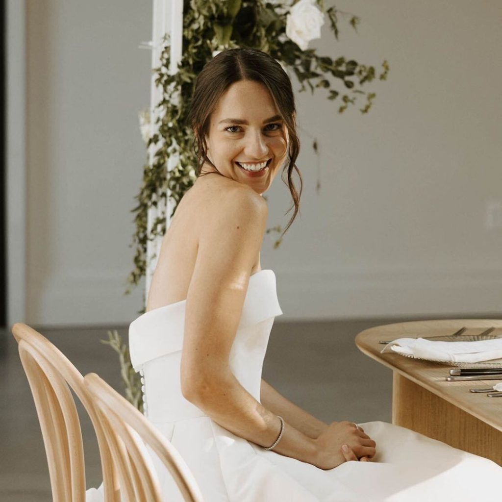 Candid wedding photo captured by a professional photographer showing natural-looking cheek color.