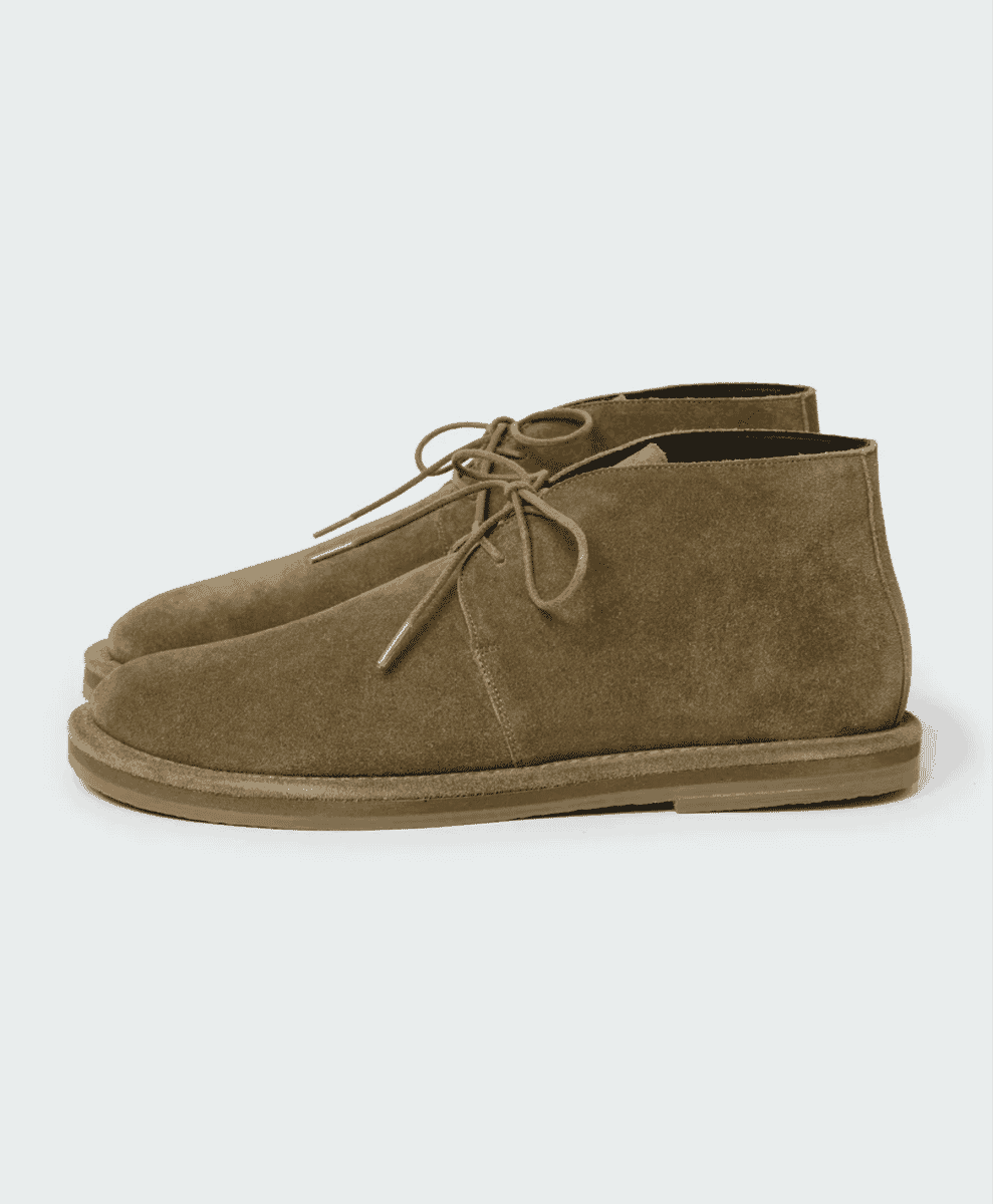 Studio Nicholson Woodrow suede shoes in a neutral tone.