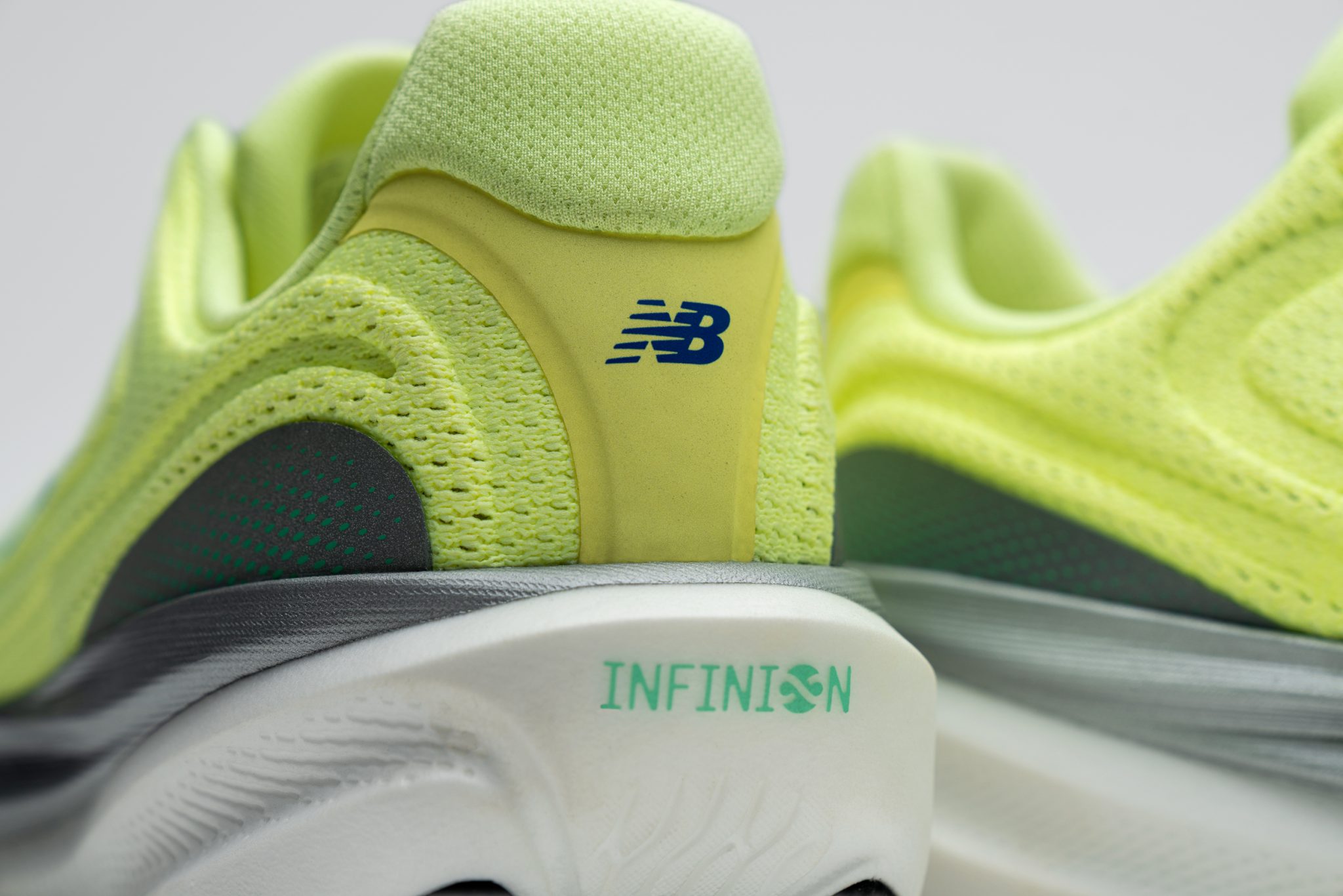 Close-up of the New Balance 1080v15 midsole with visible INFINION branding and mesh upper.