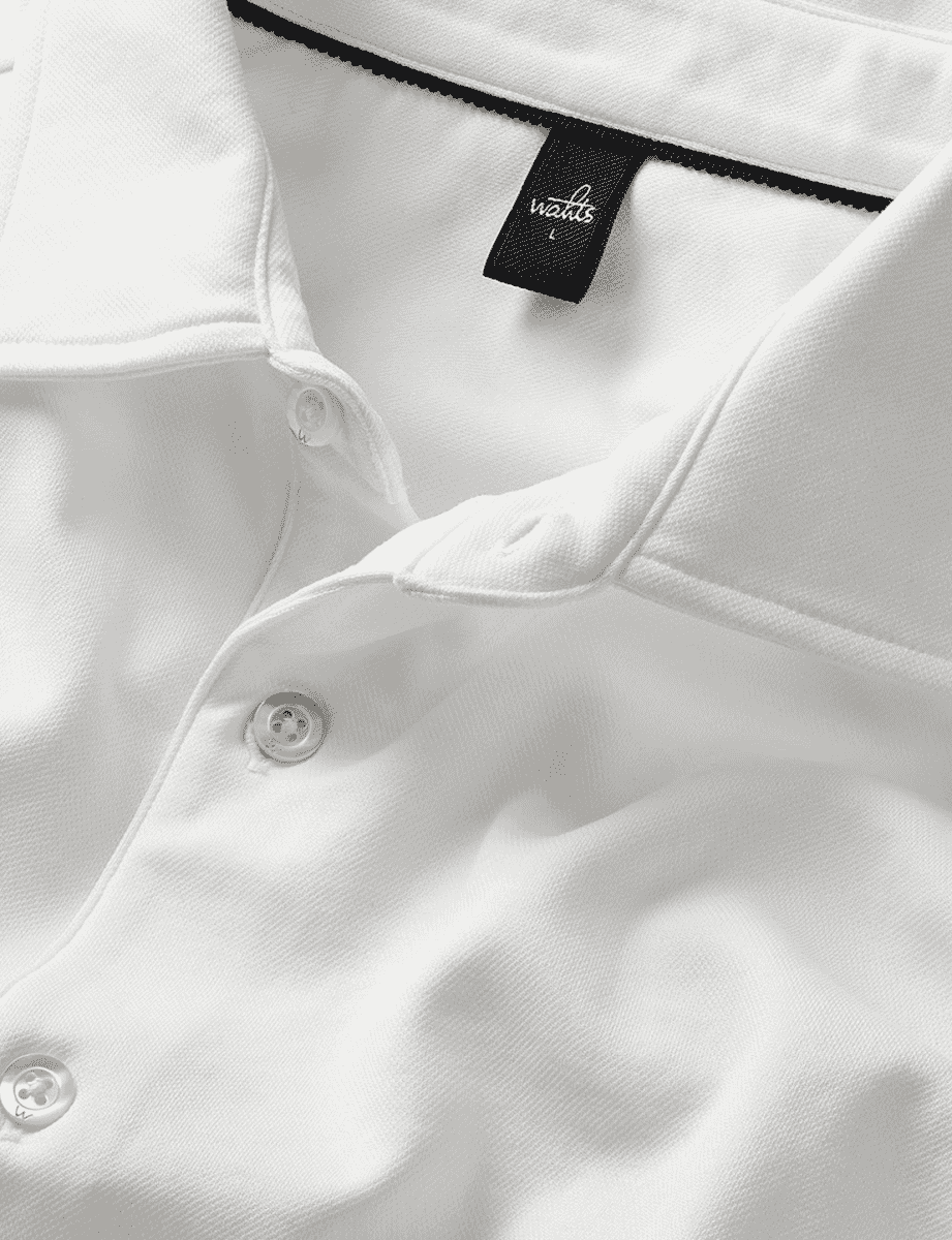 Close-up of a crisp white shirt collar.