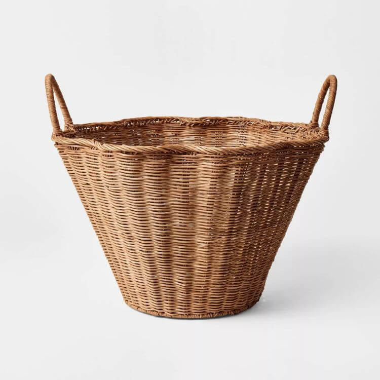Woven wicker basket with a decorative scalloped top edge.